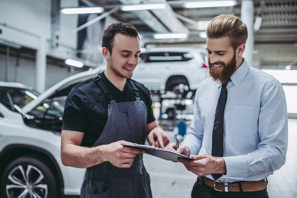 Mechanics working in shop